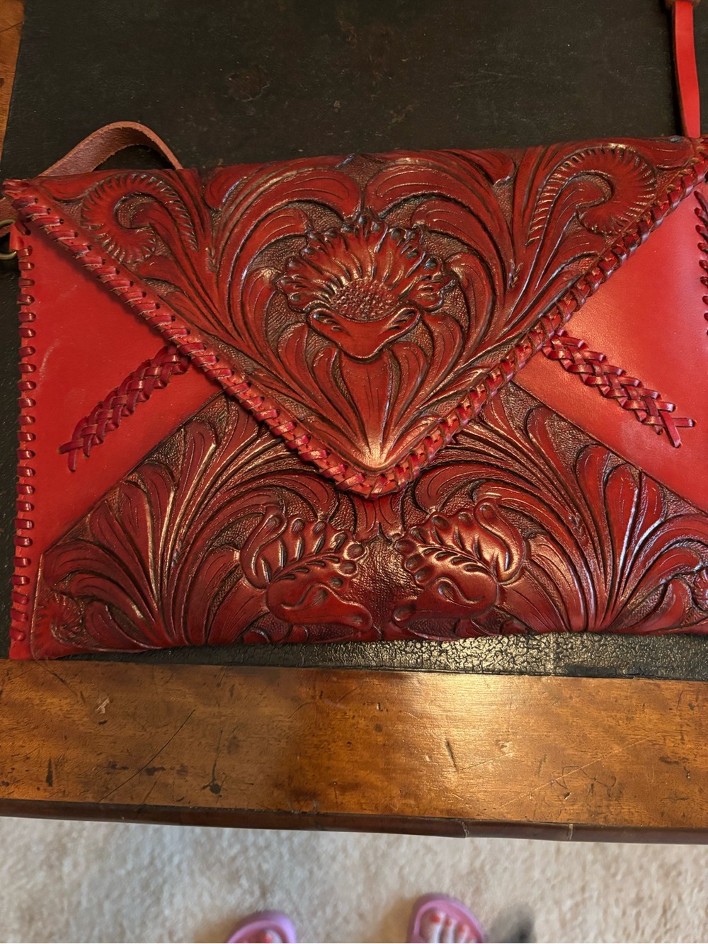 Red leather tooled envelope crossbody bag